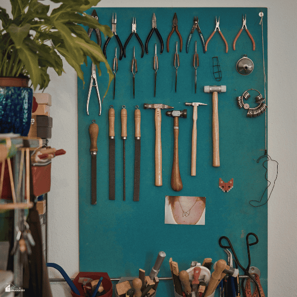 Wall with neatly arranged tools and equipment, representing simple home maintenance organization that makes tasks easier to manage.