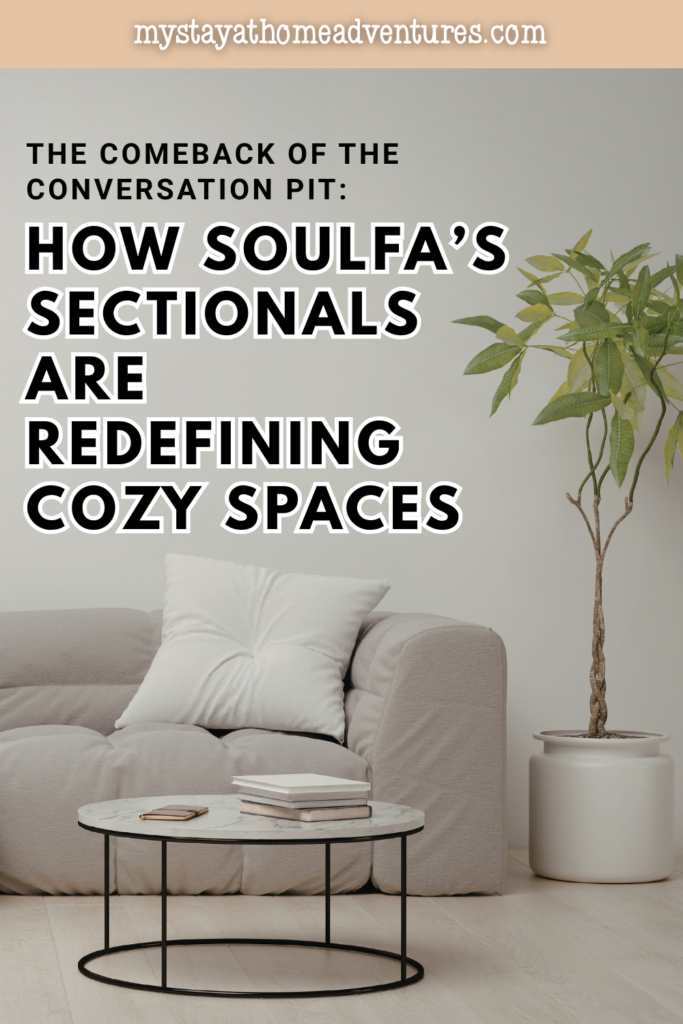 Minimal living room with a soft sectional sofa, round coffee table, and indoor plant showing a cozy conversation pit inspired seating layout.