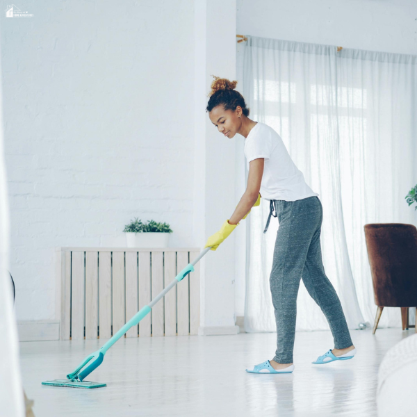 Person mopping a clean floor as part of regular household chores that keep daily routines running smoothly.