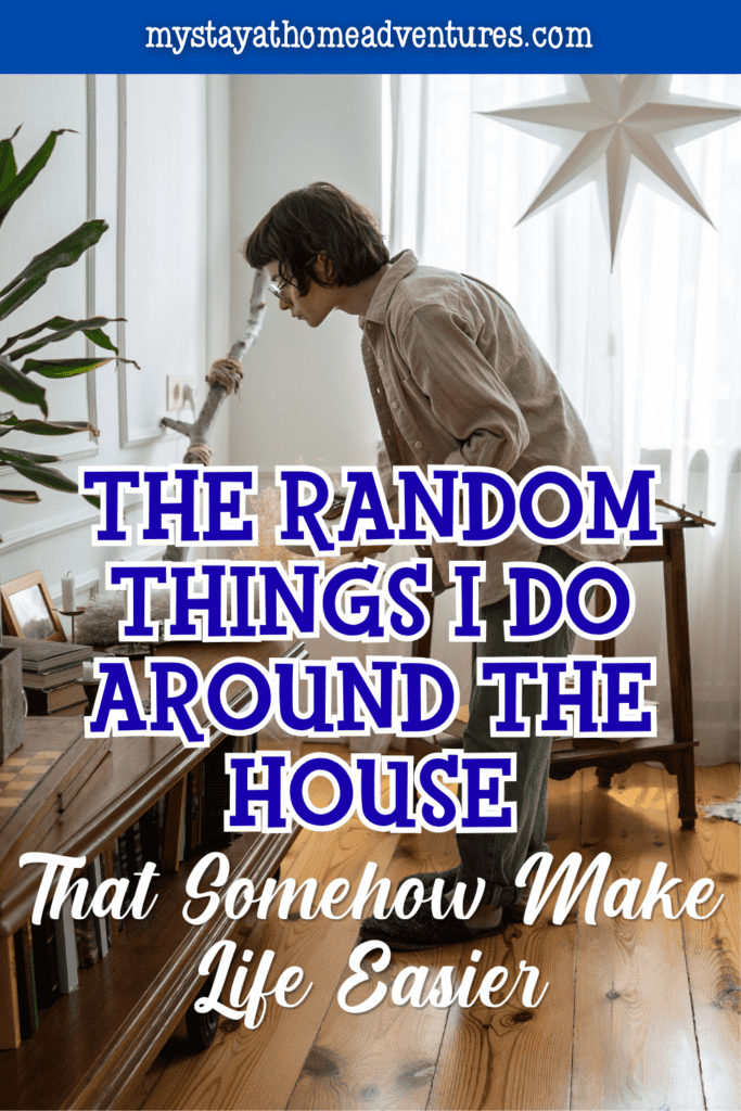 Person organizing a living room shelf and decor as part of simple habits that make everyday home life easier.