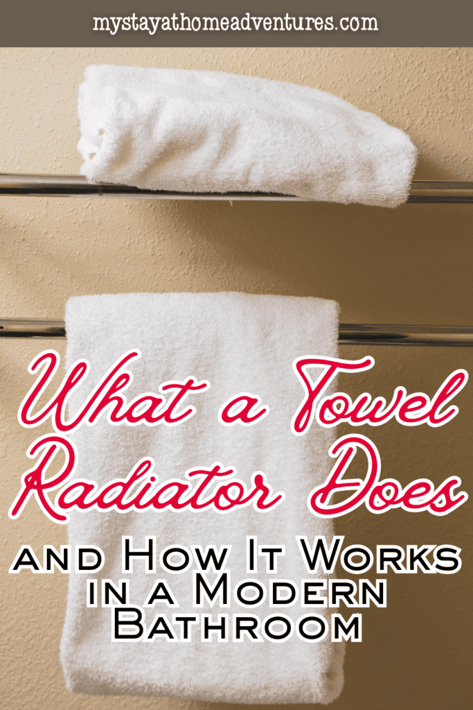 Two white bath towels placed on a towel radiator demonstrating how a towel radiator works in a modern bathroom.
