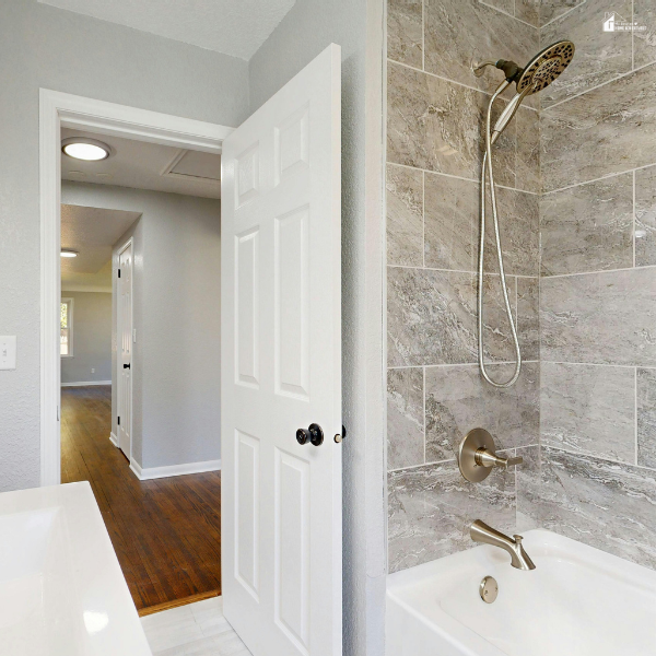 Tiled shower and bathtub area with tile backer board behind walls, showing proper installation for moisture protection in bathrooms.