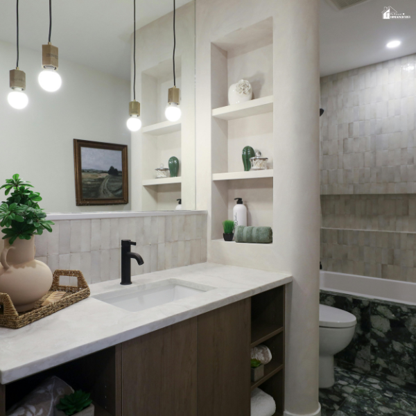 Modern bathroom with a sleek vanity, open shelving, and updated lighting, showing simple upgrades that improve style and functionality.