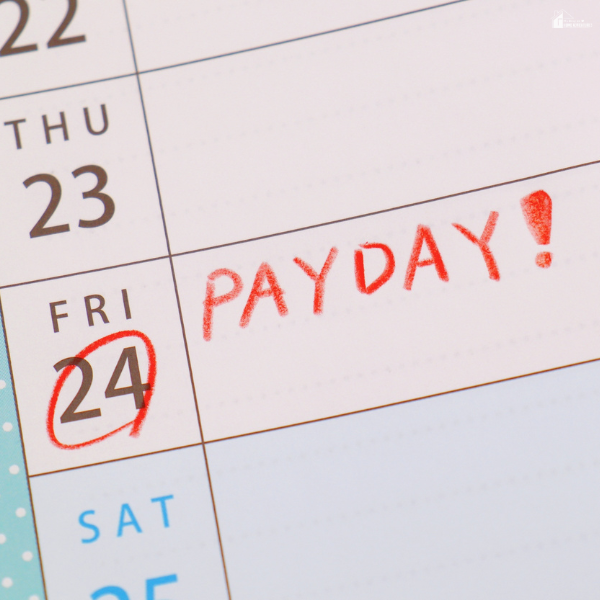 Calendar marked with a highlighted payday date, showing inconsistent income and budgeting challenges.