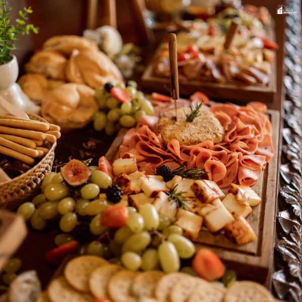 Charcuterie board with meats, cheeses, fruits, and crackers arranged for a stylish Atlanta catering display.