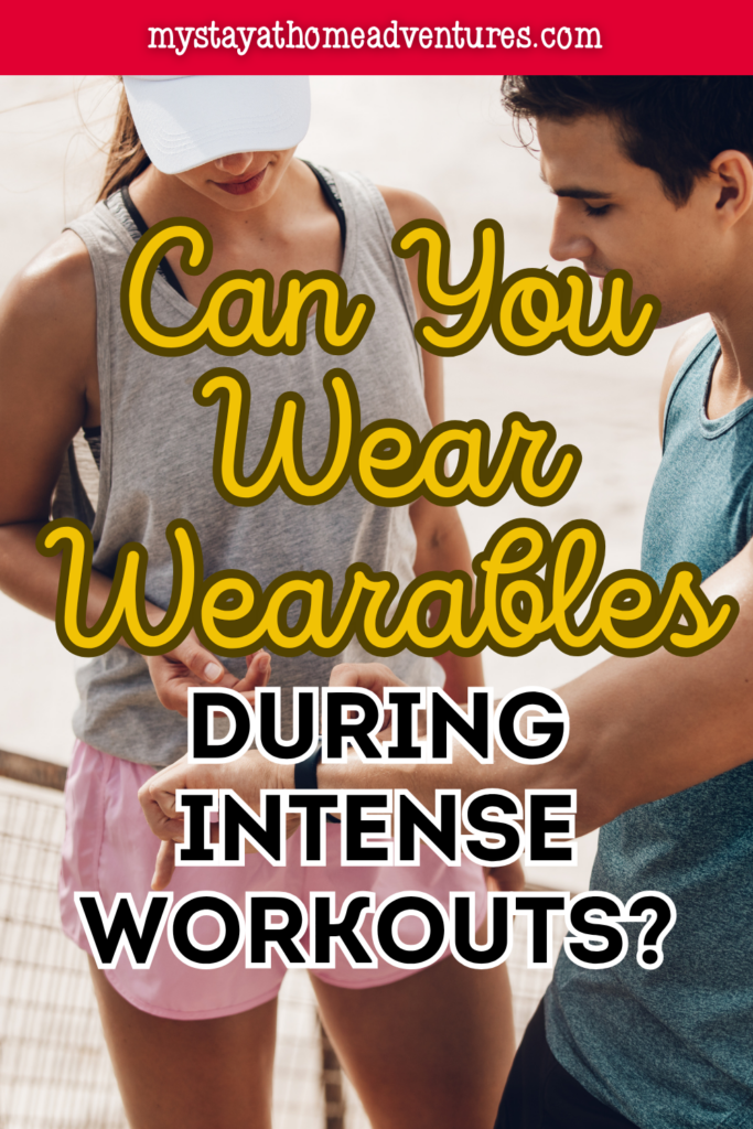 Two athletes reviewing smartwatch stats from wearables during intense workouts.