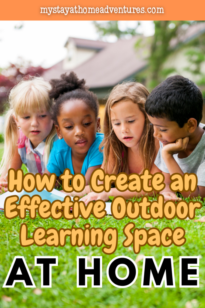 Group of children lying on grass reading together in a backyard outdoor learning space designed for creativity and focus.