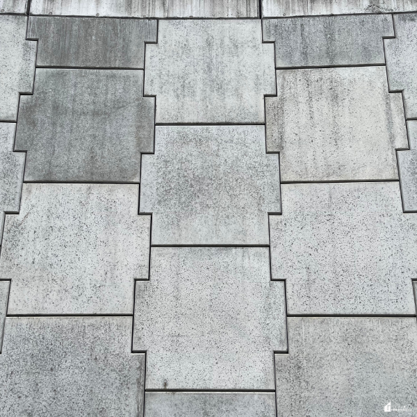 Patterned concrete or stone surface highlighting durable and affordable garage flooring upgrade options.