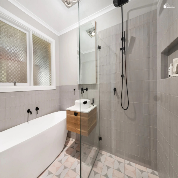 Bright bathroom remodeling layout with a walk-in shower, compact vanity, and smart storage that blends practical function with simple style.