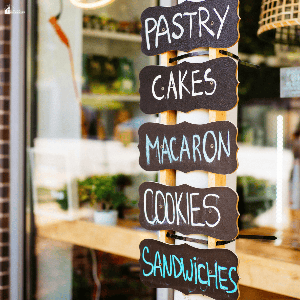 Close-up of a storefront display sign near a window, representing visibility and presentation impacted by shopfront window condition.