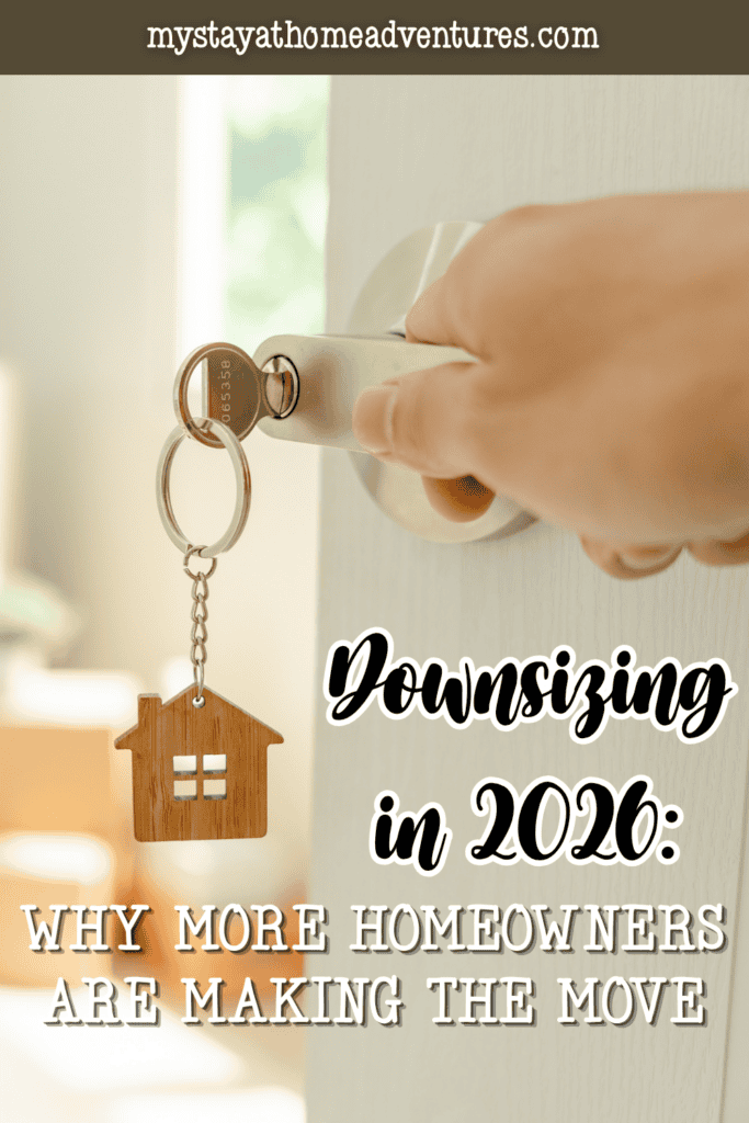 Hand unlocking a modern home door with a wooden house keychain symbolizing downsizing and relocation decisions.