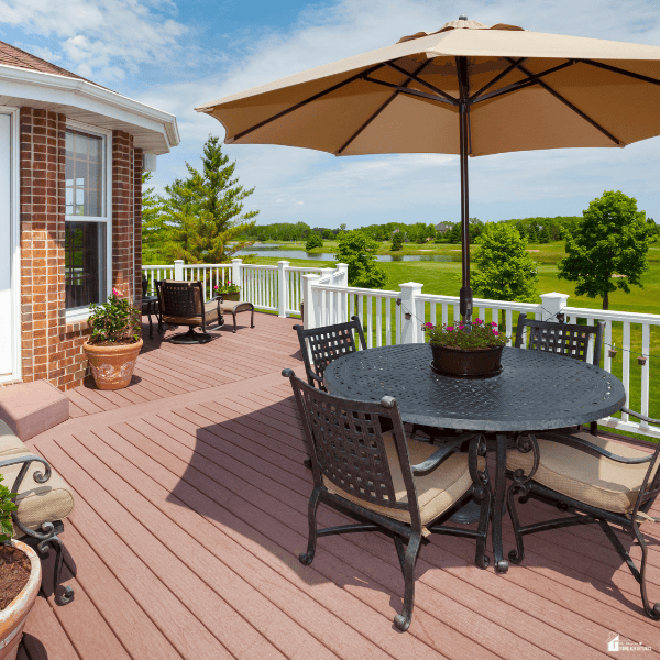 Spacious backyard deck with patio dining furniture and garden planters showing stylish ways to combine outdoor living and gardening at home.