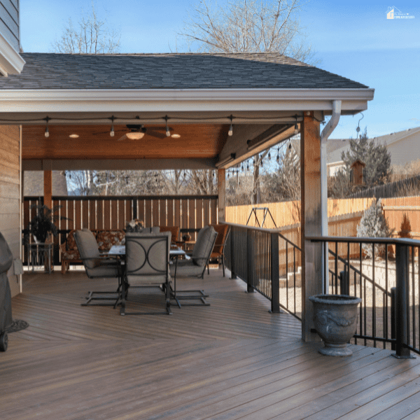Covered wooden deck with cozy seating and open entertaining space featuring practical ideas for blending outdoor living areas with gardening features.
