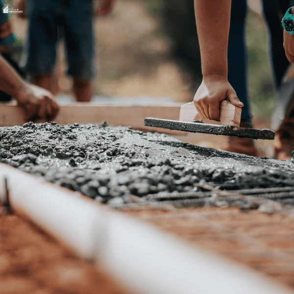 Fresh concrete foundation work showing the importance of proper drainage systems for long-term structural support and water control around a property.