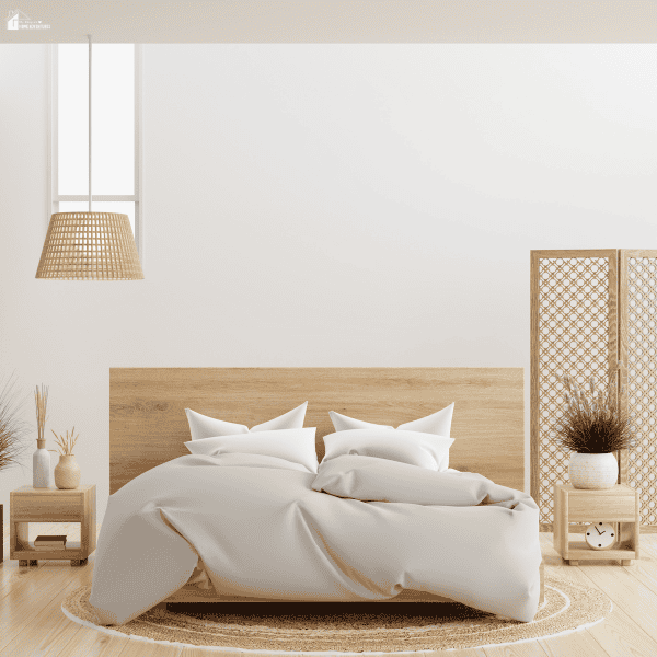 Minimalist bedroom with soft bedding, natural wood furniture, and a calm layout focused on comfort and relaxation.