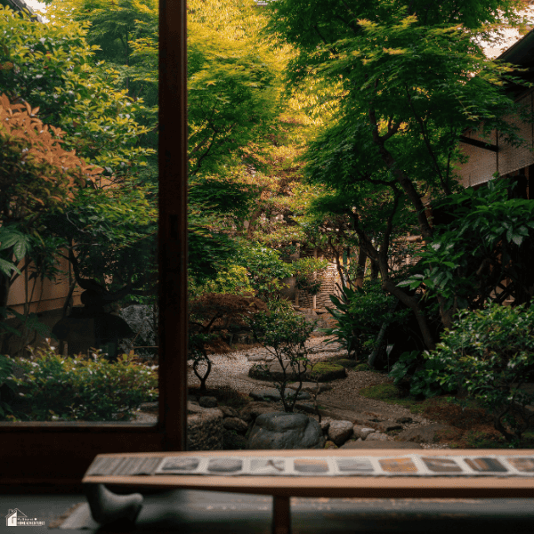 Peaceful backyard garden view from inside a cozy garden room, highlighting the relaxing atmosphere families want in outdoor living spaces.