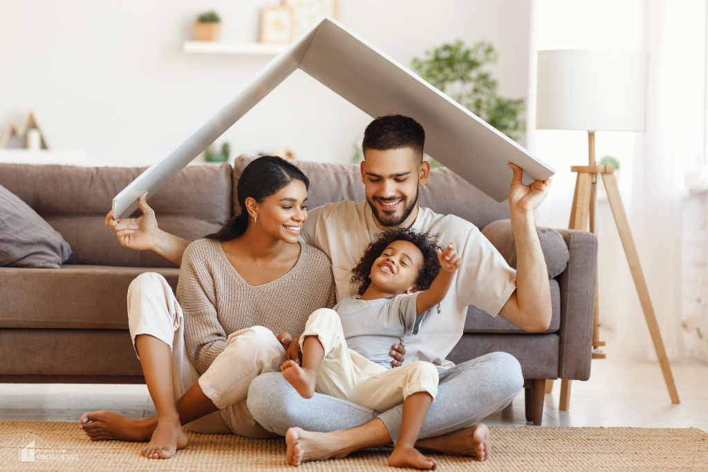 Family sitting together in cozy living room holding cushion overhead, representing a safe, comfortable, and family-ready home environment.