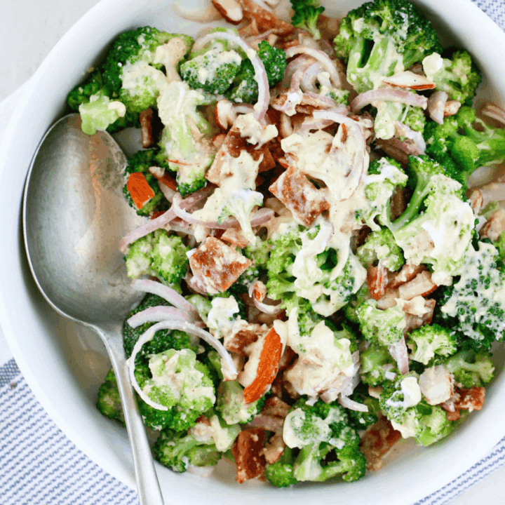 Easy broccoli salad with bacon, red onion, almonds, and creamy dressing served cold as a fresh summer side dish.
