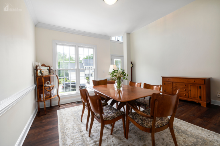 Bright dining room with natural light, wooden furniture, and open layout creating a comfortable and functional home environment for everyday living.