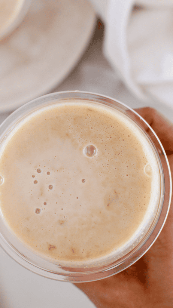 Close-up view of smooth and creamy peanut butter limber in a plastic cup ready to serve.