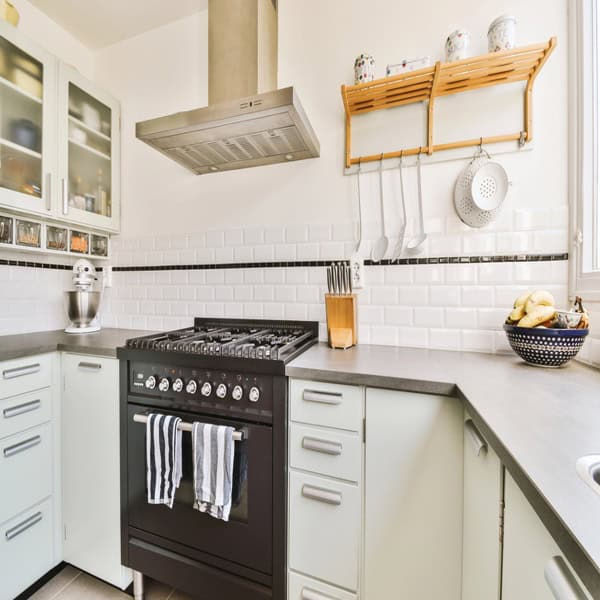 Bright modern kitchen with organized counters and functional storage created to support a family’s daily living needs.