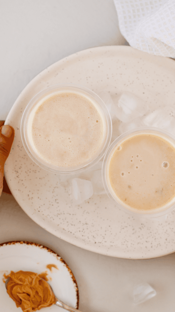 Overhead view of two homemade peanut butter limbers served on a plate with ice cubes.
