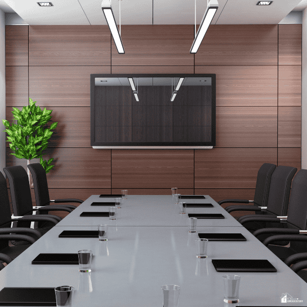 Professional meeting space with presentation equipment and conference seating, showcasing features organizations should evaluate when choosing an off-site venue.