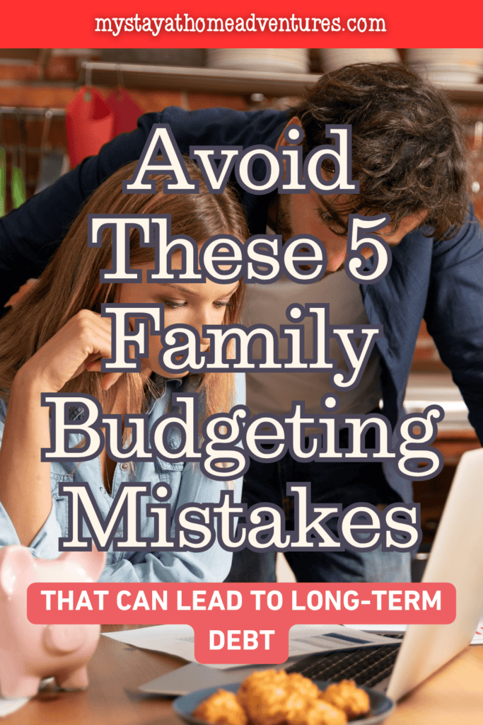 Parents reviewing household finances on a laptop, illustrating common family budgeting challenges and debt prevention strategies.