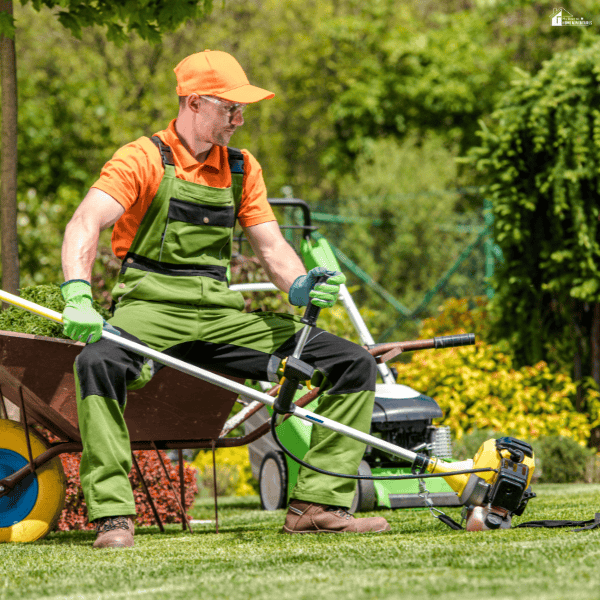 Person preparing landscaping equipment for a yard improvement project, highlighting tools often rented for weekend landscaping tasks.