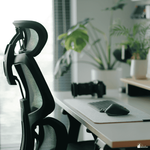 Ergonomic office chair with supportive design features placed at a modern desk for improved comfort and posture.
