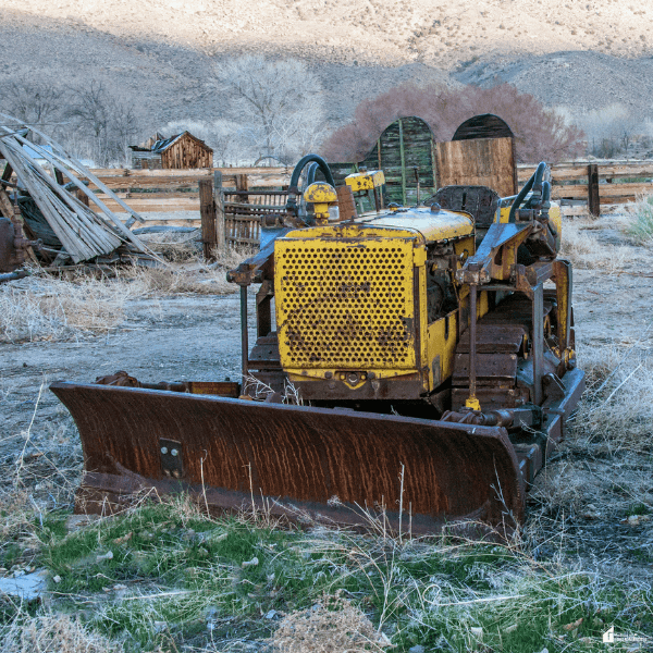 Heavy-duty bulldozer parked on a ranch, representing equipment that helps improve efficiency during busy agricultural seasons.