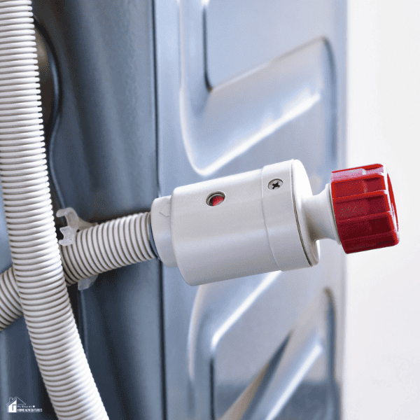 Close-up of a washing machine water inlet hose connection, highlighting a component that can cause leaks if damaged or loose.