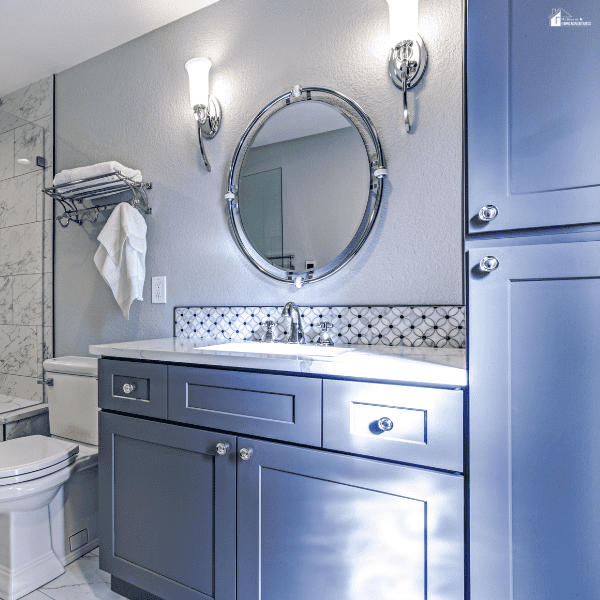 Bathroom design featuring color accents that pair well with light wood vanities to create a bright and balanced space.