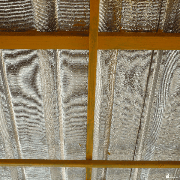 Roofing assembly with thermal insulation designed to manage roof heat dynamics and improve indoor temperature stability.