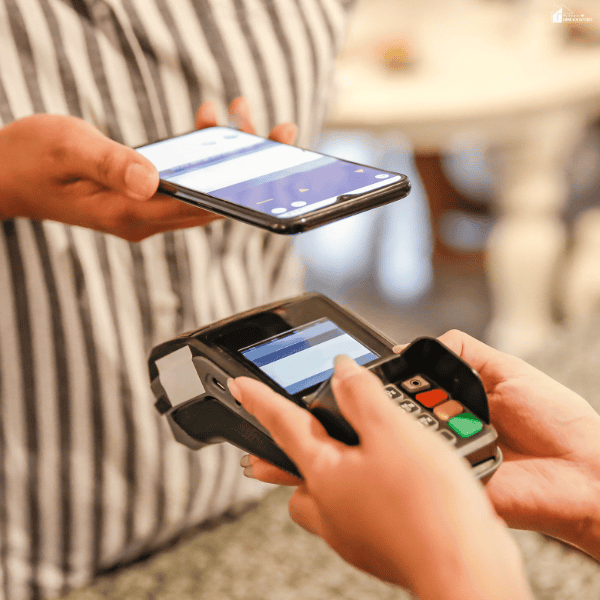 Digital wallet being used for a contactless payment at a checkout terminal, highlighting fast and secure mobile transactions.