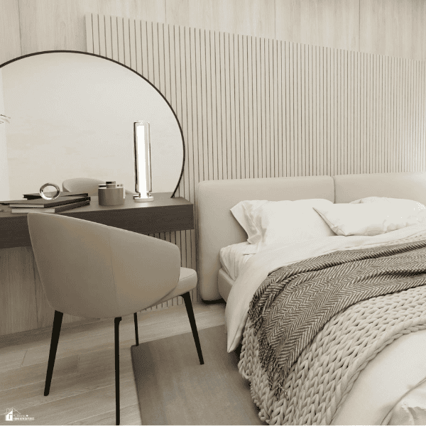 Modern bedroom with layered blankets, soft bedding, and neutral décor, creating a warm and inviting space for cooler weather.