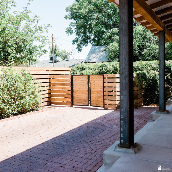 Secure residential backyard with a wooden privacy fence, gated entry, and enclosed outdoor space designed to improve property security and privacy.