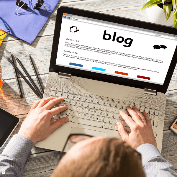 A person creates blog content on a laptop while using SEO tips to improve search visibility and attract more visitors.
