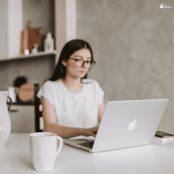 Professional using a laptop to build new skills and advance career growth through remote work opportunities.