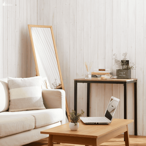 Bright, modern living room featuring a floor mirror, stylish furnishings, and decorative accents that showcase luxury home upgrades without major remodeling.