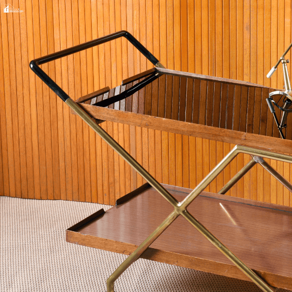 Elegant bar cart with wood shelves and metal accents, showcasing a stylish luxury home upgrade for entertaining and enhancing living spaces.