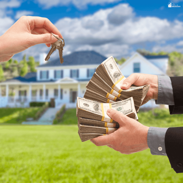 Homeowner exchanges house keys for cash, illustrating a direct property sale without traditional financing in Chicago.
