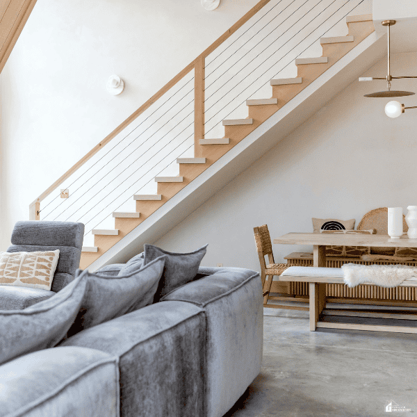 A bright, modern living room with comfortable furniture shows a well-prepared home ready for short-term rental guests.