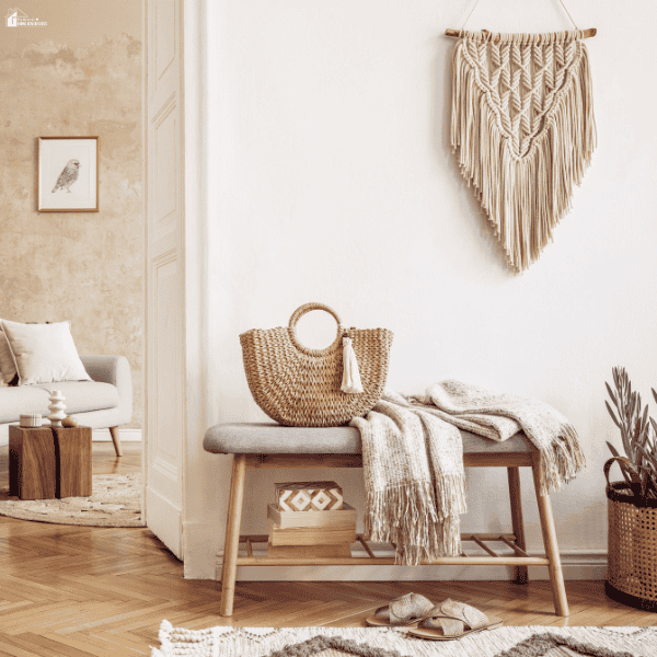 A bright entryway features woven baskets, textured textiles, and wall decor that refresh a living space with stylish accessories.