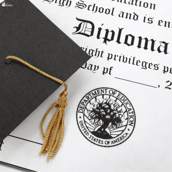 Black graduation cap with a gold tassel resting on a homeschool diploma, representing a completed homeschool education milestone.