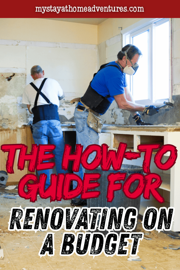 Two workers removing old kitchen materials and fixtures during a budget-friendly home renovation project.