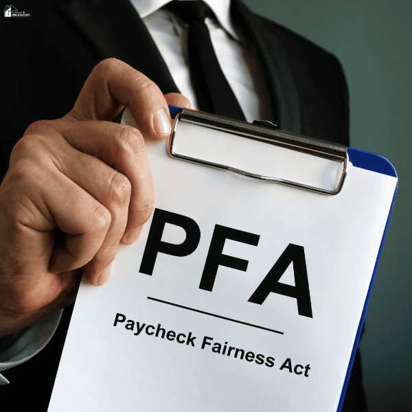 Business professional holding workplace compensation documents while reviewing how a minimum wage increase may affect employee pay rates.