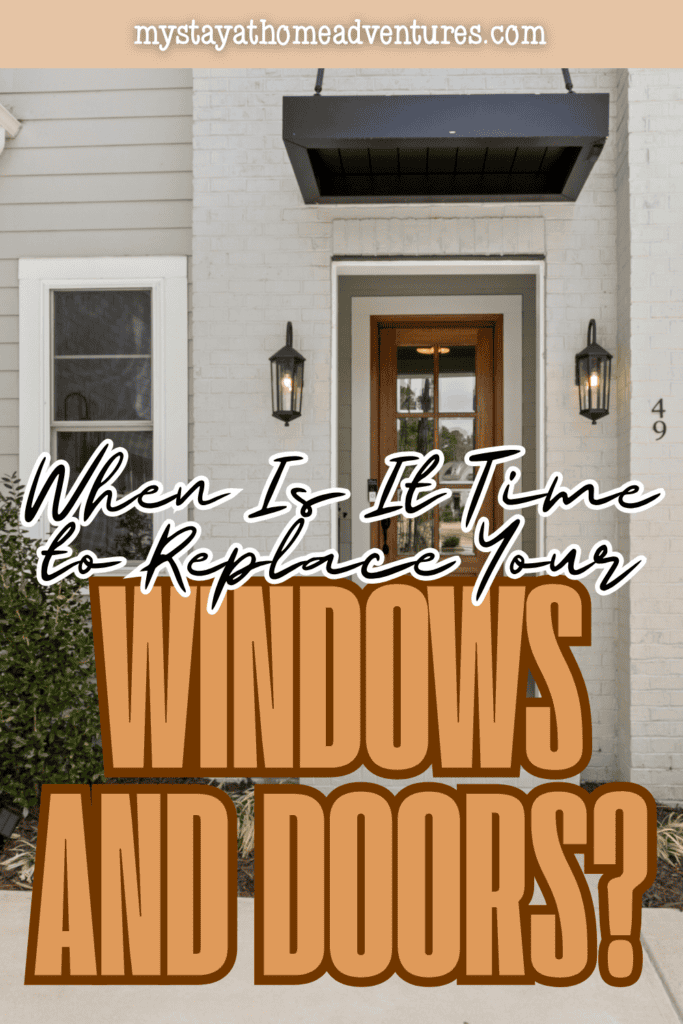 Modern home entrance with a wooden front door and nearby window, illustrating exterior features homeowners may evaluate for age, damage, and replacement needs.