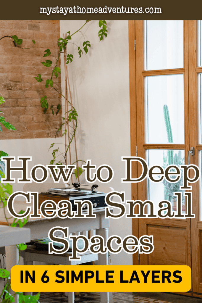 Compact room with plants, a record player, wooden doors, and hard-to-reach surfaces that can be tackled during a layered deep-cleaning routine.