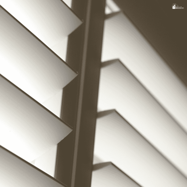 Angled white louvers block direct sunlight to help reduce heat and glare.